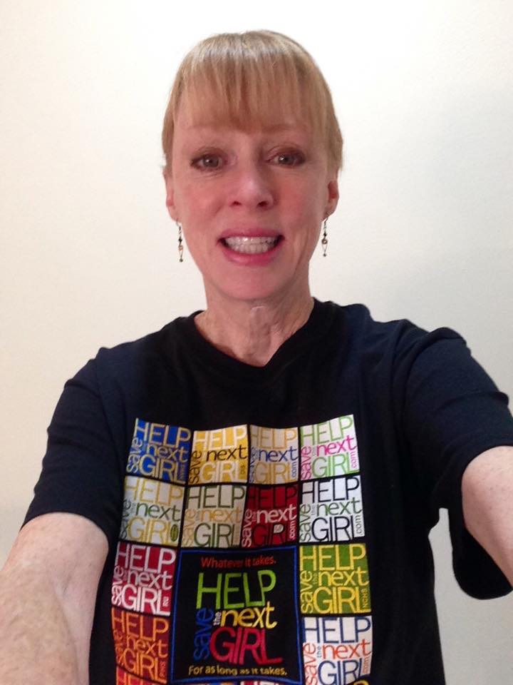 Gil Harrington wearing a Help Save The Next Girl t-shirt
